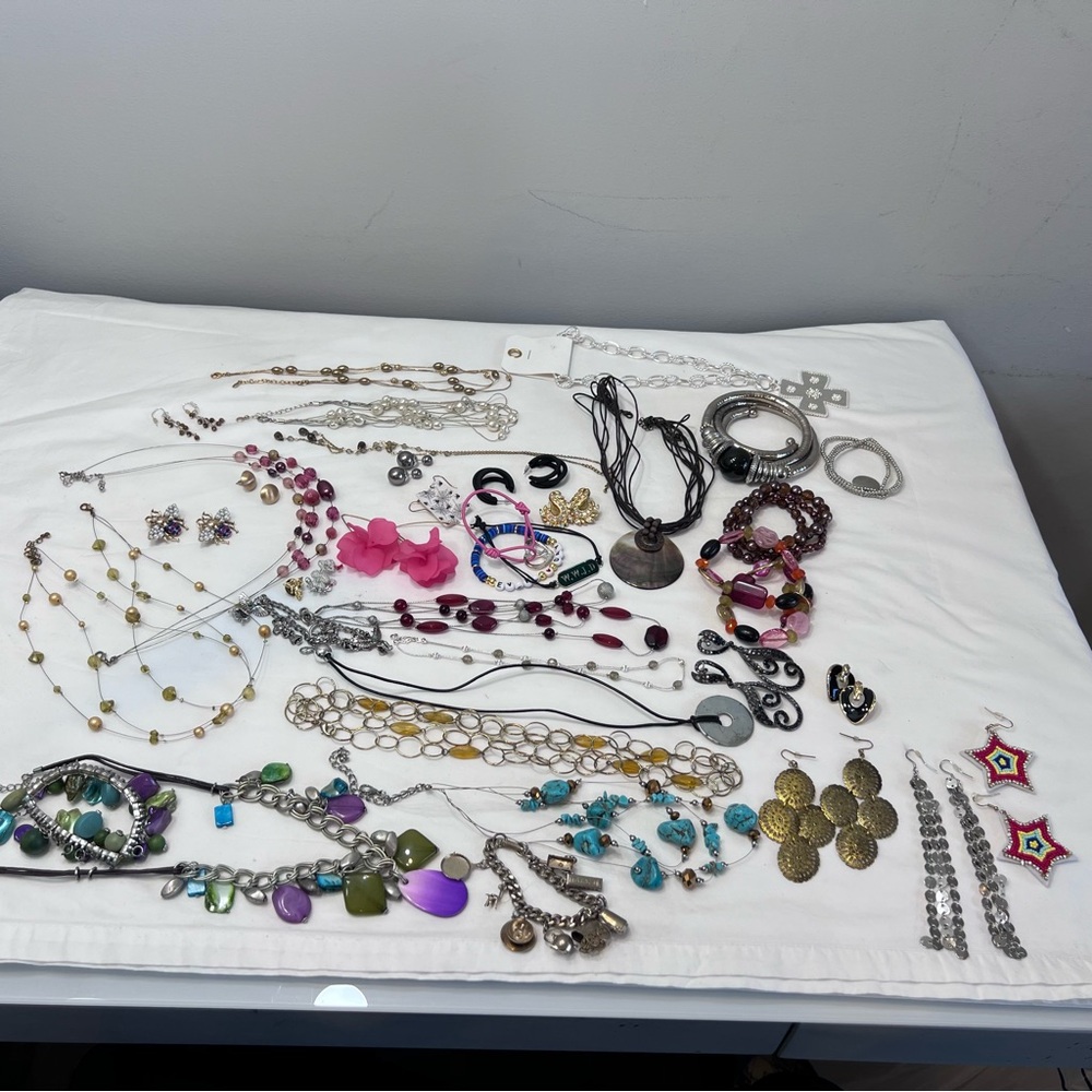 Lot bundle of costume jewelry. Necklaces bracelets earrings pins